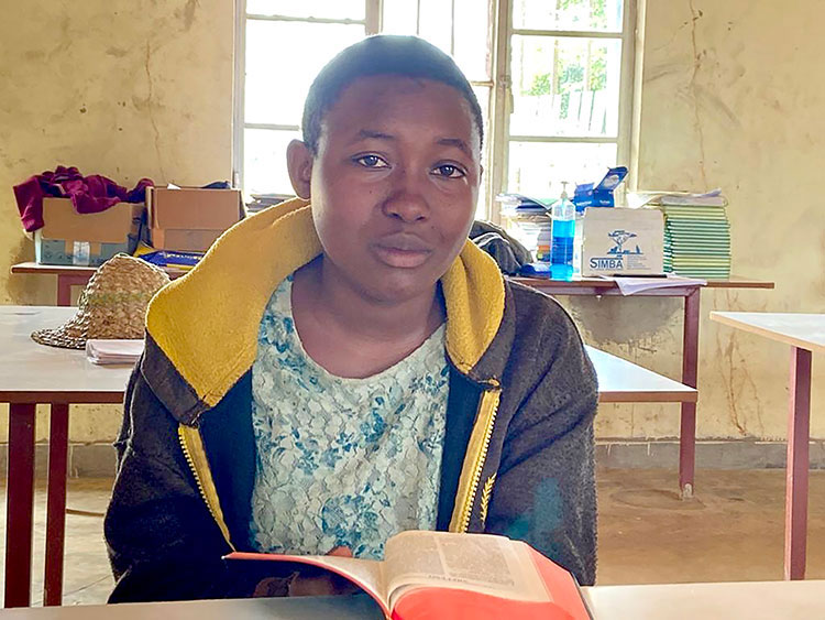 Image of Tabitha from Rwanda with her Bible