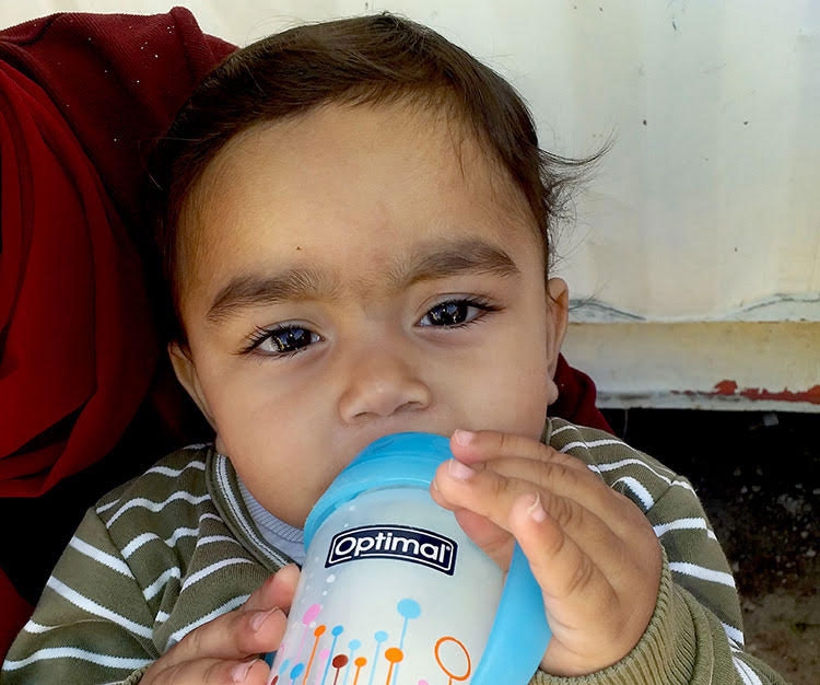 Picture of refugee baby in Syria with nutritious formula