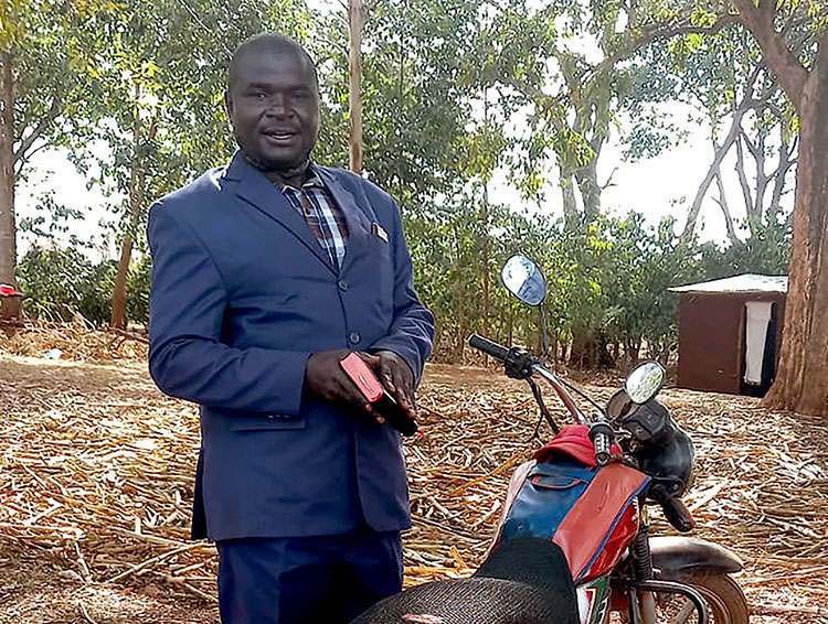Image of evangelist with new motorbike