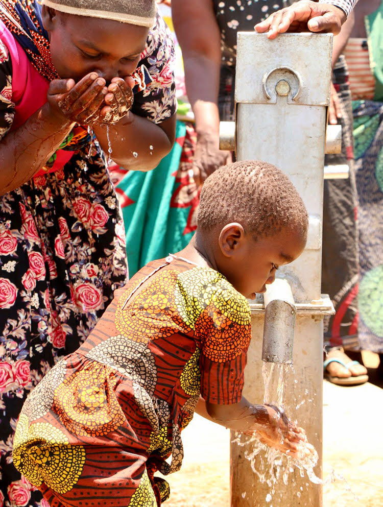 Picture of girl drinking clean water from well in Malawi