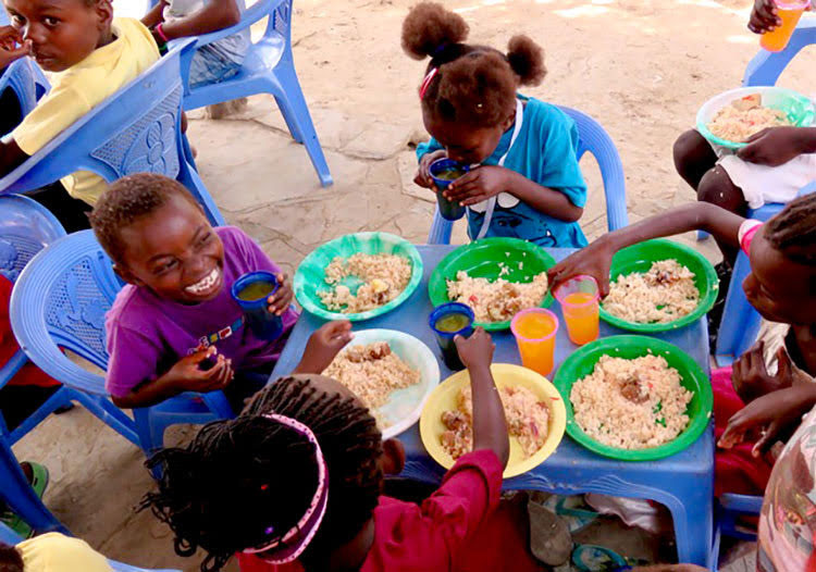 Picture of kids eating healthy meals in Kenya