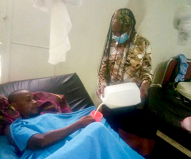 Image of prisoner in Rwanda receiving milk