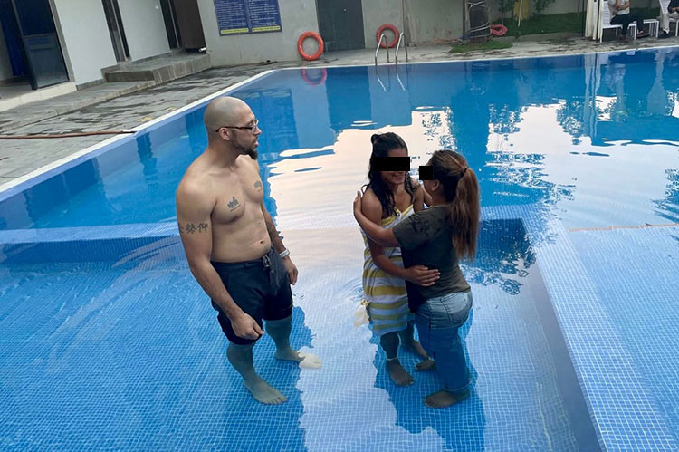 Image of baptism in swimming pool