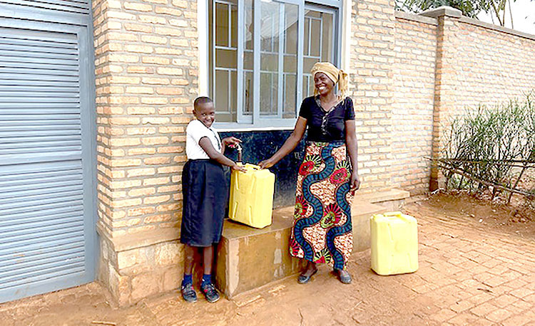 Image of mom in Rwanda with safe water