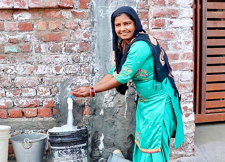 Image of villager with clean water