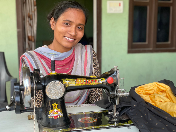 Image of woman in India with sewing machine