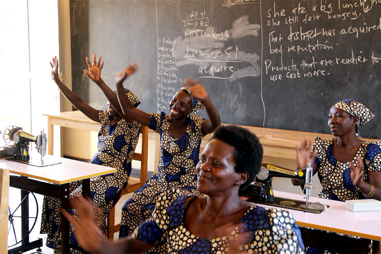Image of women in Rwanda in classroom learning to sew