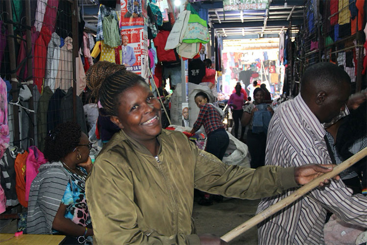 Image of woman in Kenya selling clothes